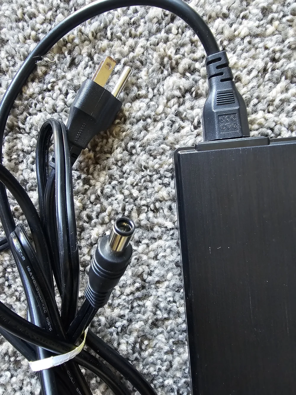 Shenzhen FJ-SW202821007150 switching power adapter.  Input: 100-240V~ 50/60Hz 3